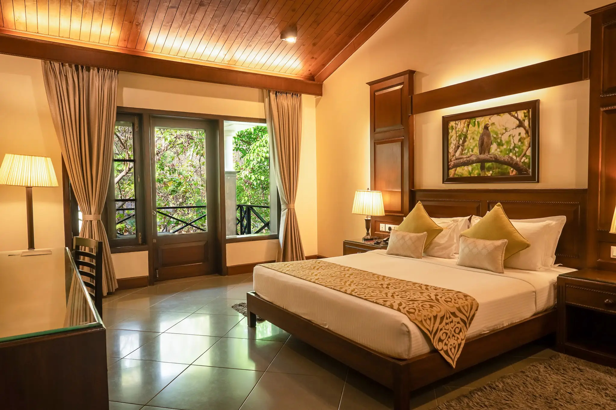 Aahana bedroom interiors with balcony overlooking the forest