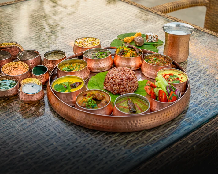 a copper thali of Kumaoni food at Aahana Resort