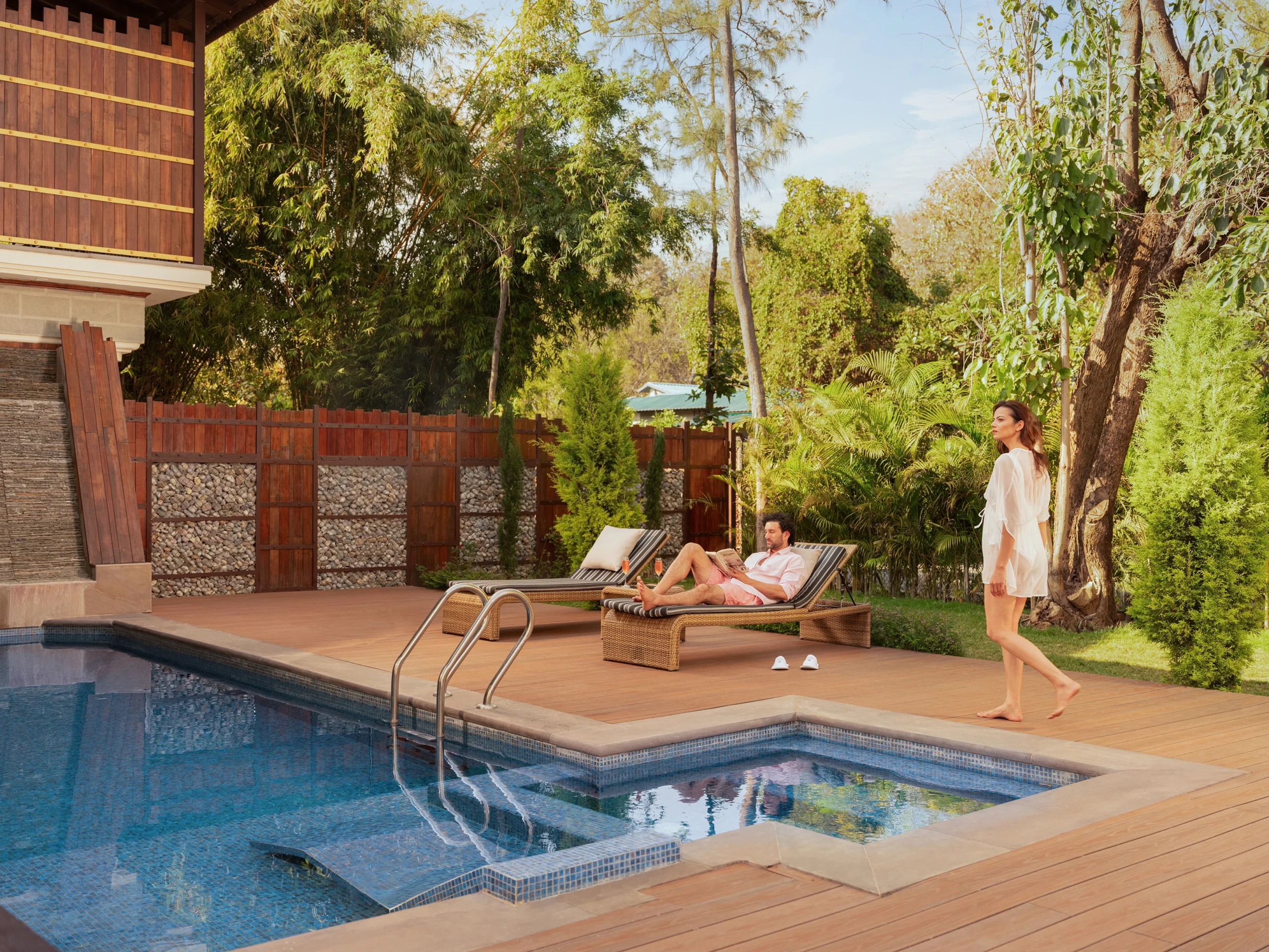 guests in their private pool villa in aahana