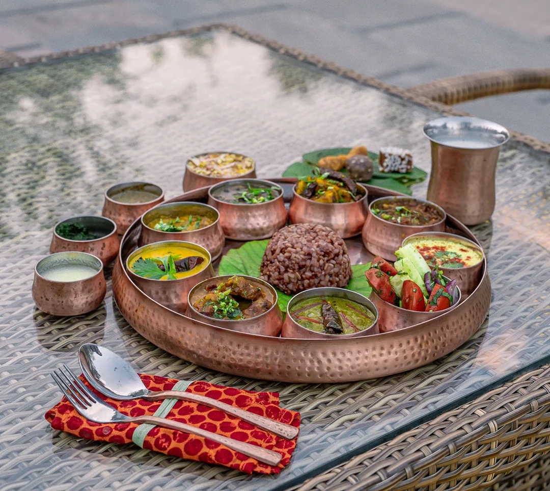 a copper thali of Kumaoni food at Aahana Resort