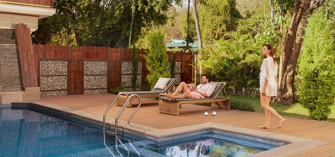 couple relaxing at Aahana pool villa