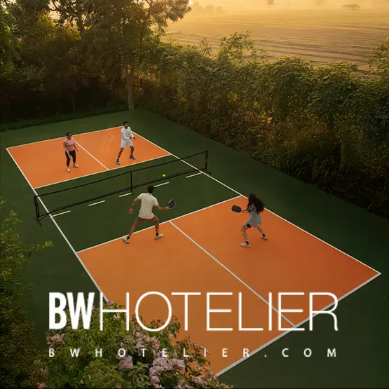 Pickleball court at Aahana Resort surrounded by forest